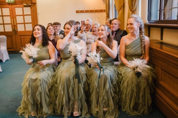 bridesmaids watching their friend Sheffield Town Hall for the wedding