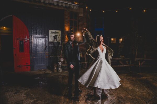 night time photograph of bride and groom dancing outside Yellow Arch Studios in Sheffield
