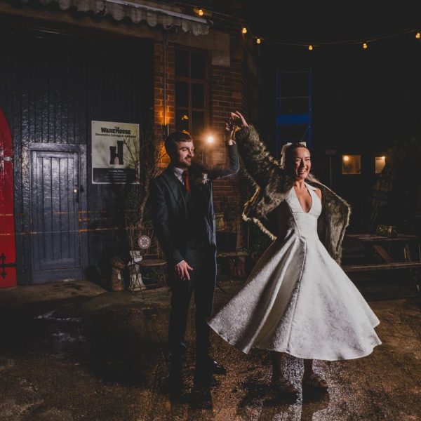 night time photograph of bride and groom dancing outside Yellow Arch Studios in Sheffield